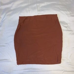 Burnt orange mini skirt, stretchy material